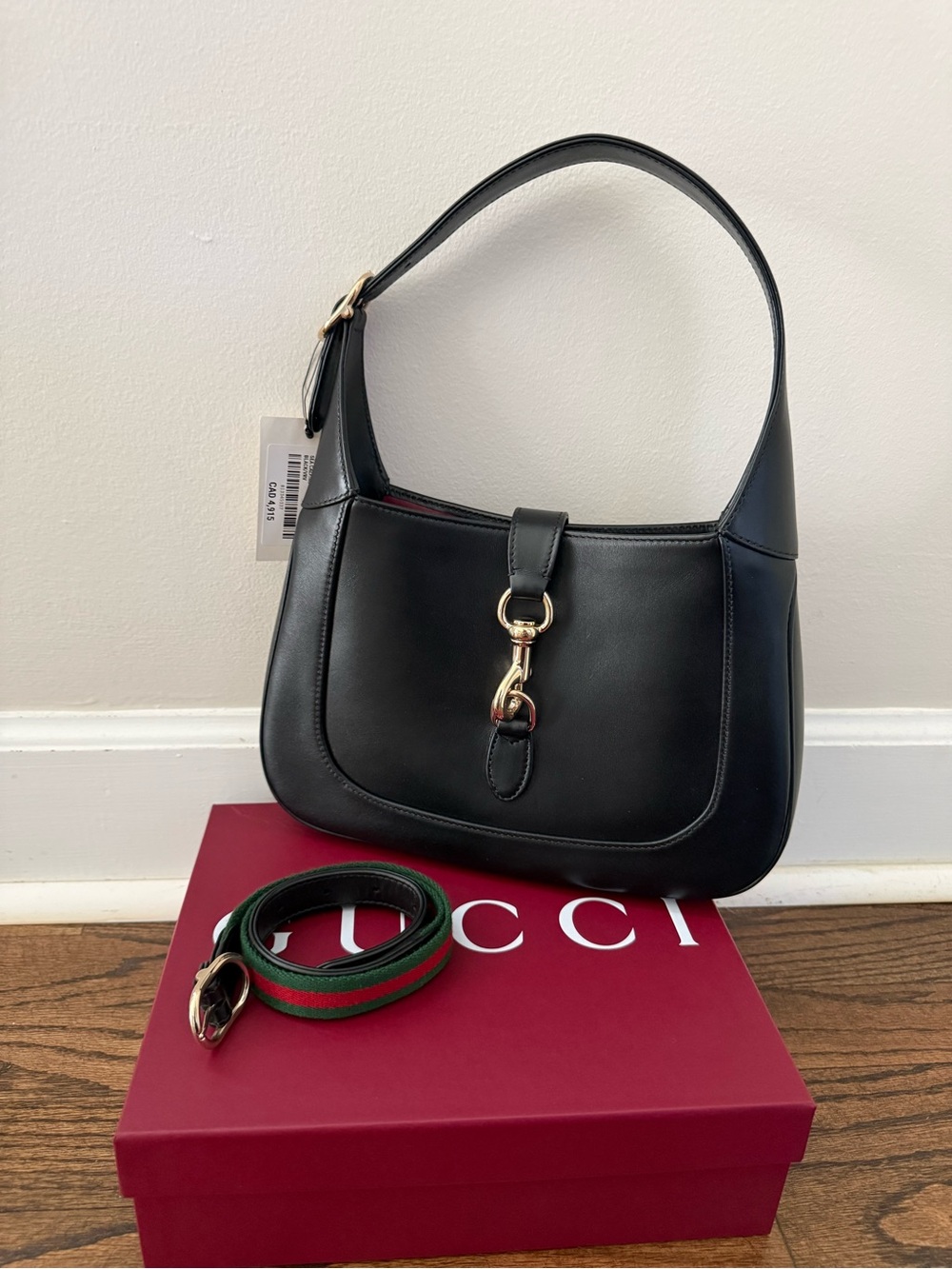 Gucci Black Leather Shoulder Bag with Gold Horsebit Accent